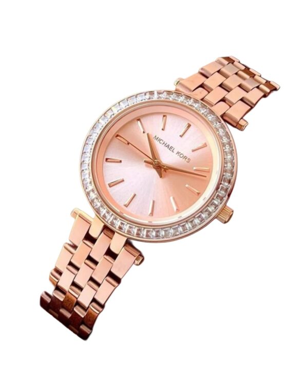 Ladies Everest watch by Michael Kors. This piece is simply stunning. It is made from  Rosegold colour steel and features a beautiful glitzy stone set bezel.